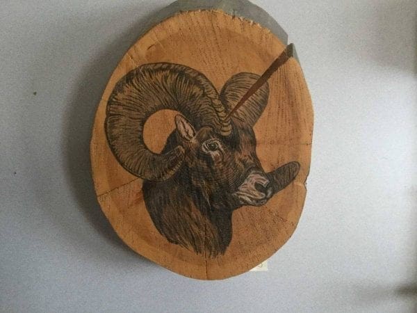 hand painted ram on log