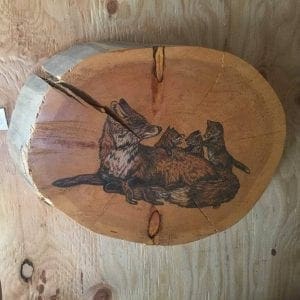 hand painted foxes on log