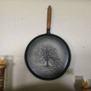Hand painted tree on cast iron pan